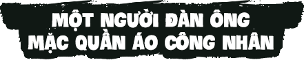 Một người đàn ông mặc quần áo công nhân